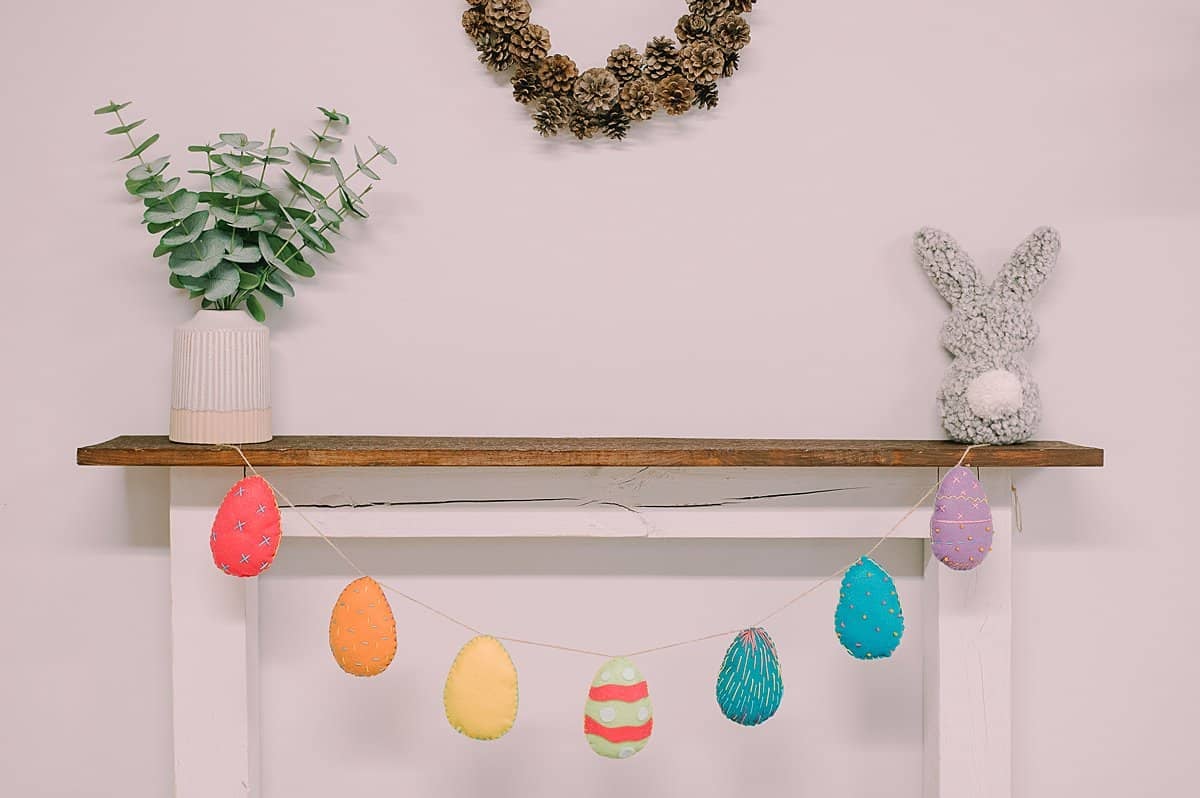 A garland made with colorful felt easter eggs.