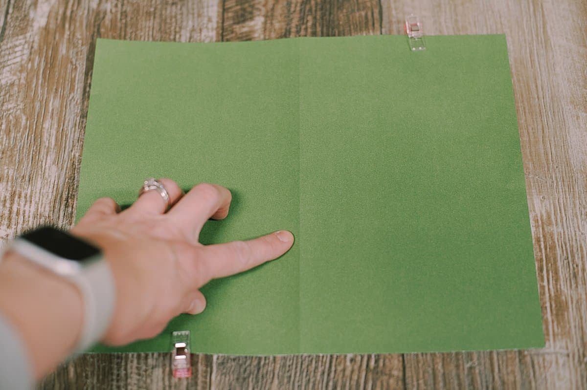 Folded paper ready to be sewn together to make a book.