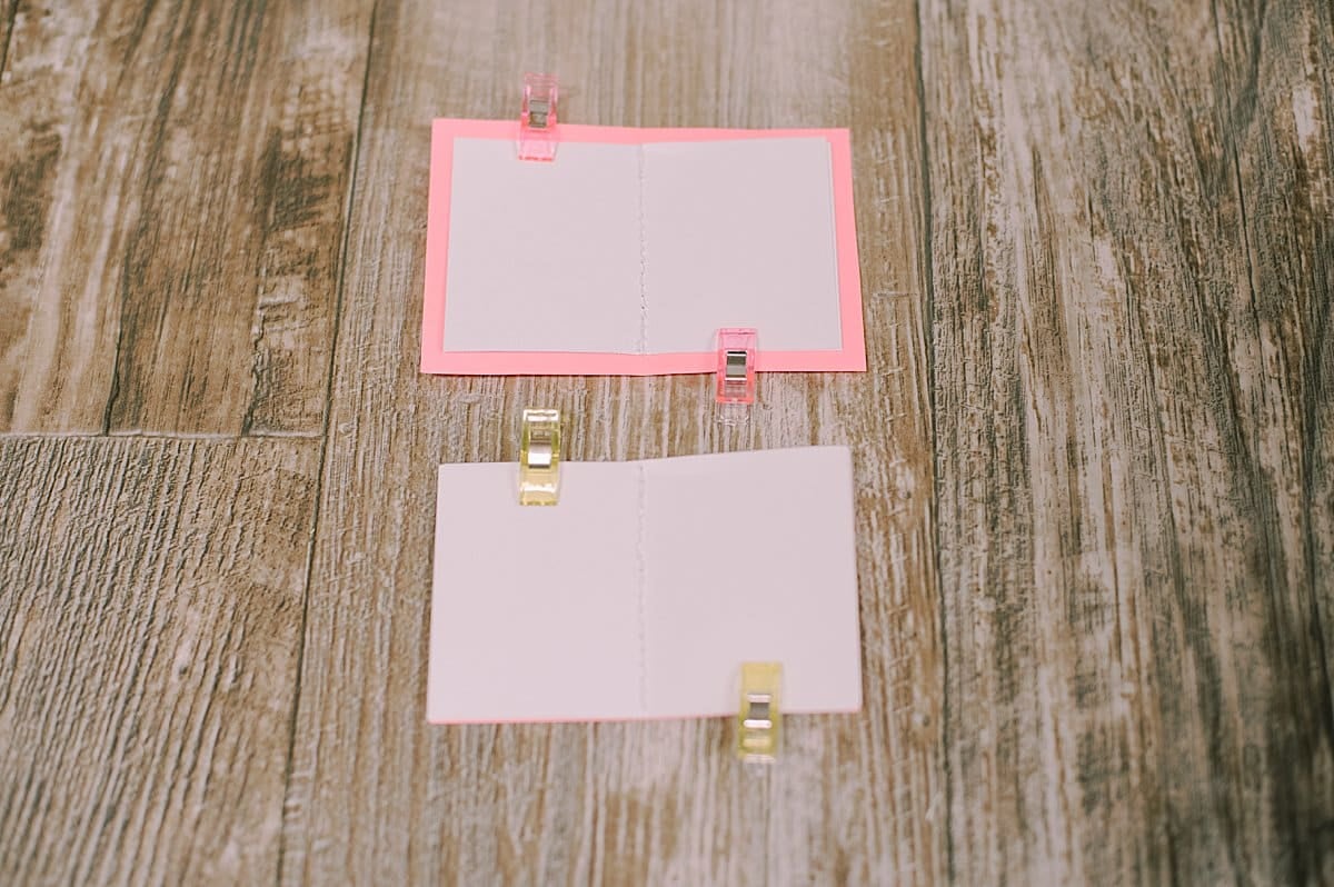 clip paper together before sewing into books