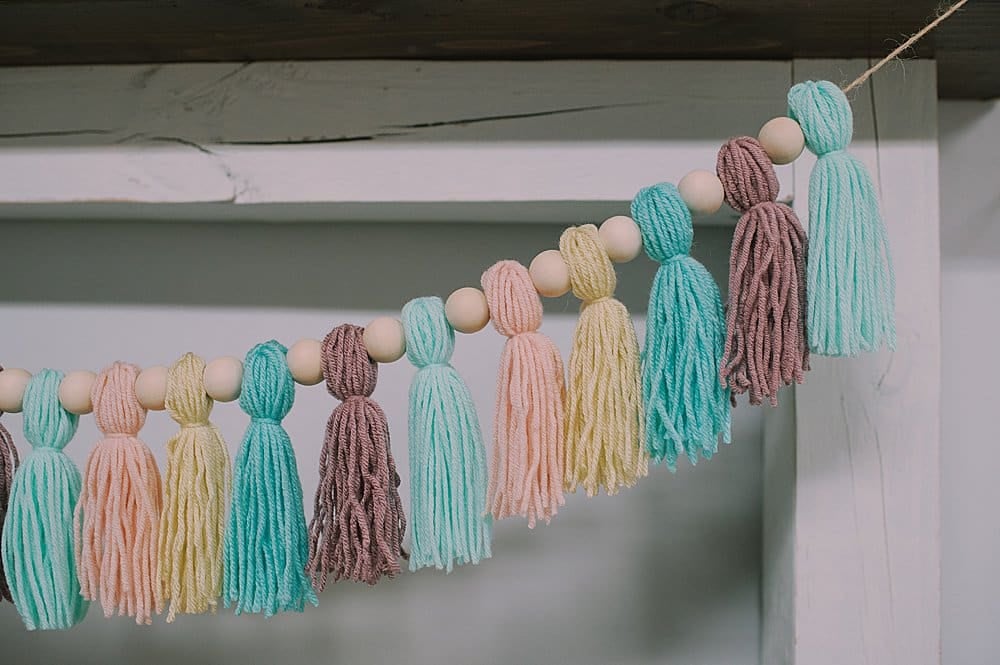 garland with wooden beads and yarn tassels