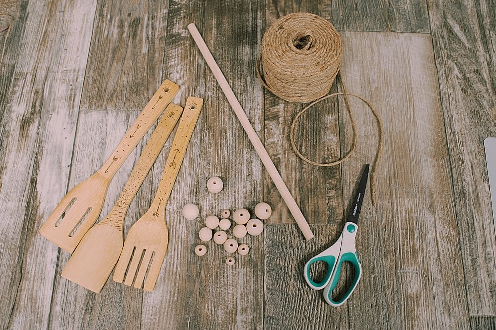 Learn how to make a DIY woodburned wooden utensil wall hanging out of wood kitchen spoons by woodburning dots and arrows!