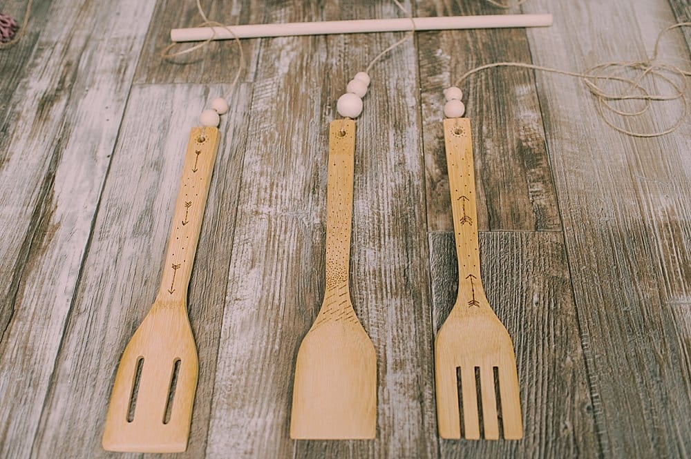 Learn how to make a DIY woodburned wooden utensil wall hanging out of wood kitchen spoons by woodburning dots and arrows!