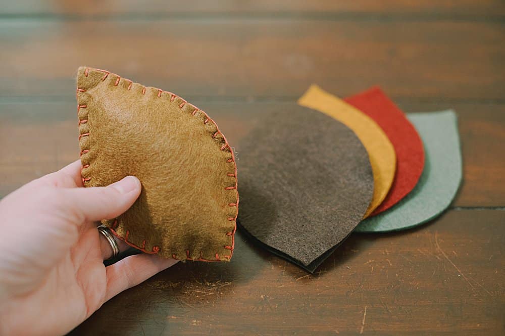 sew the felt leaf closed with the blanket stitch