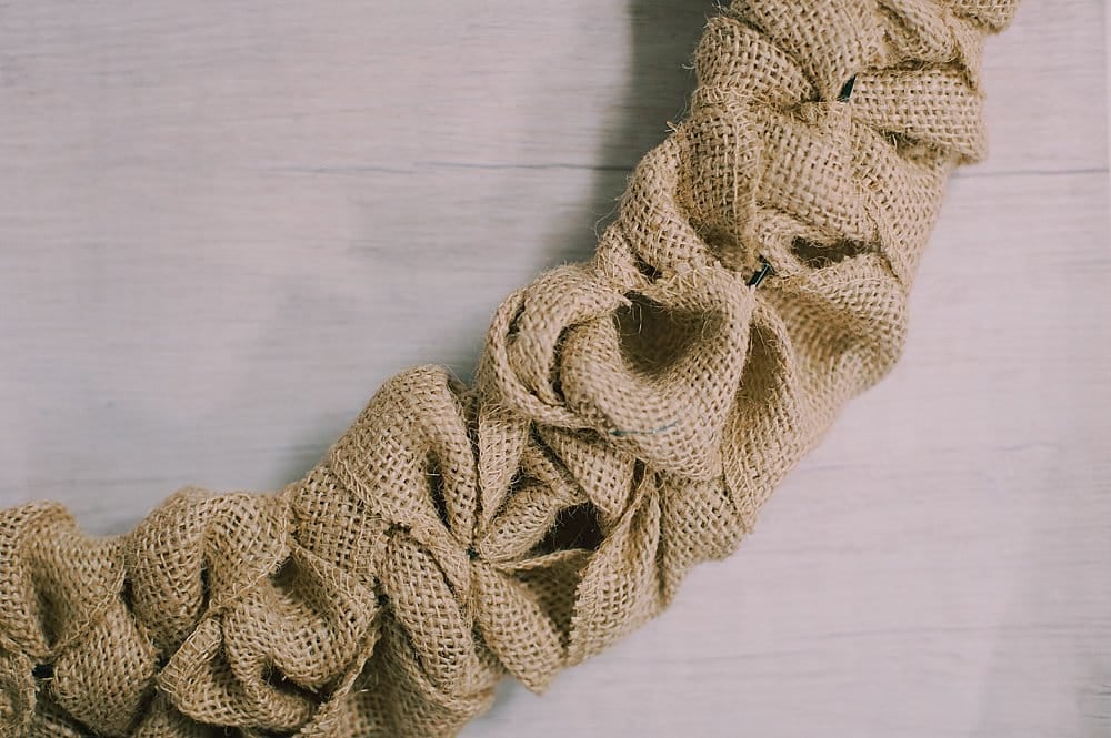Burlap ribbon texture as part of a burlap ribbon wreath.
