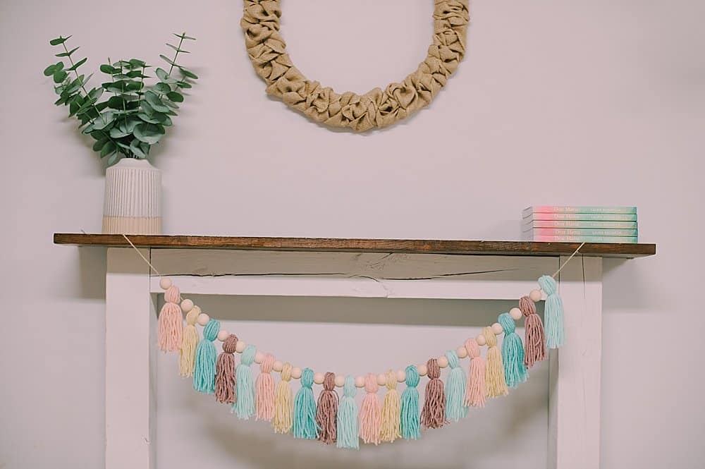 garland with wooden beads and yarn tassels