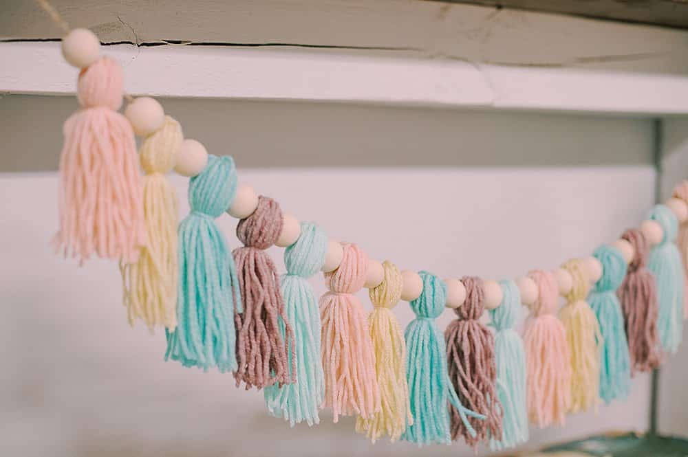 garland with wooden beads and yarn tassels