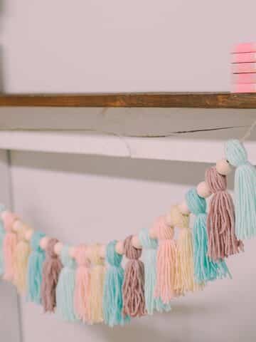 how to make a pastel yarn tassel garland