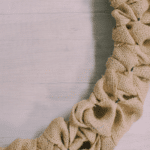 How to make a burlap ribbon wreath using a wire wreath form and burlap ribbon.
