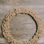 How to make a burlap ribbon wreath using a wire wreath form and burlap ribbon.
