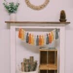 How to make a Fall Tassel Garland using yarn and wooden beads and twine as the hanging string.