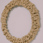 How to make a burlap ribbon wreath using a wire wreath form and burlap ribbon.