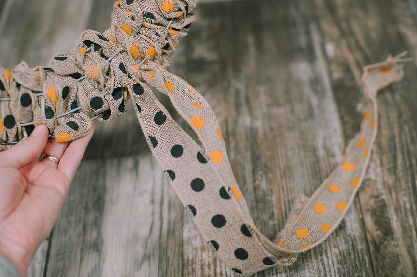 Tie the ends into a bow to finish off the DIY Halloween wreath.