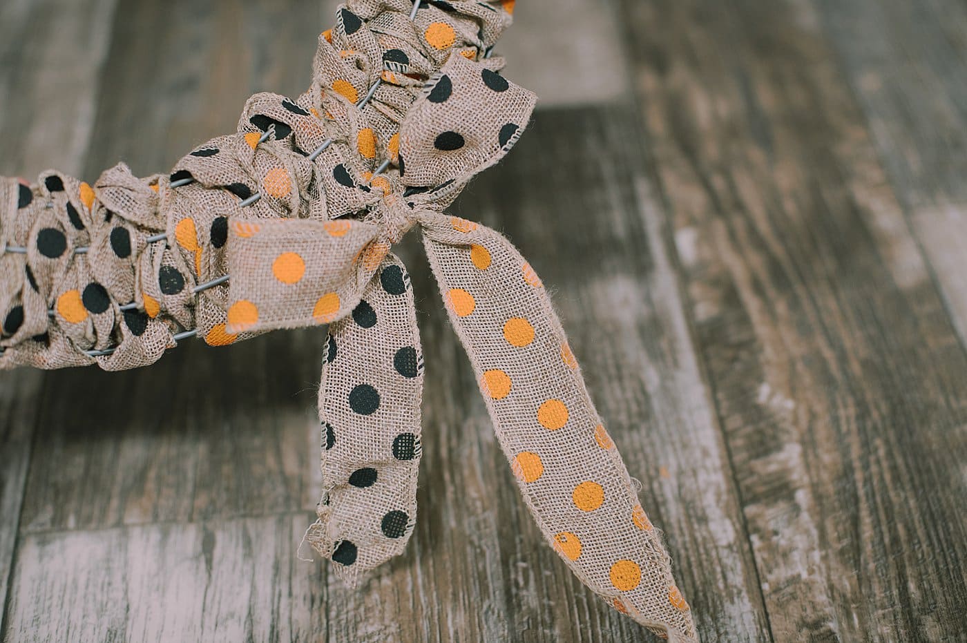 Tie the ends into a bow to finish off the DIY Halloween wreath.