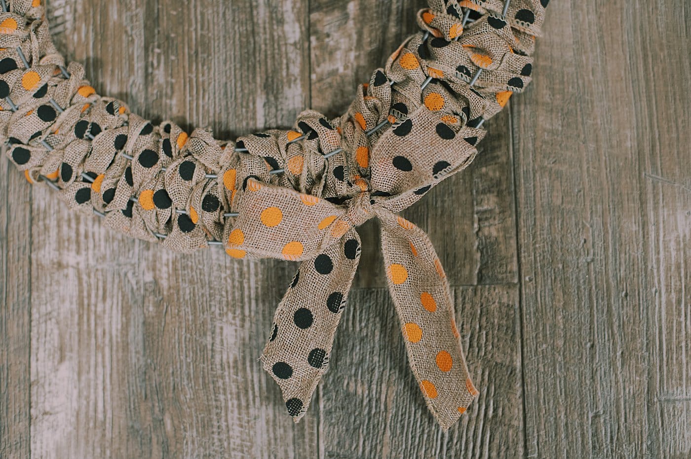 Tie the ends into a bow to finish off the DIY Halloween wreath.