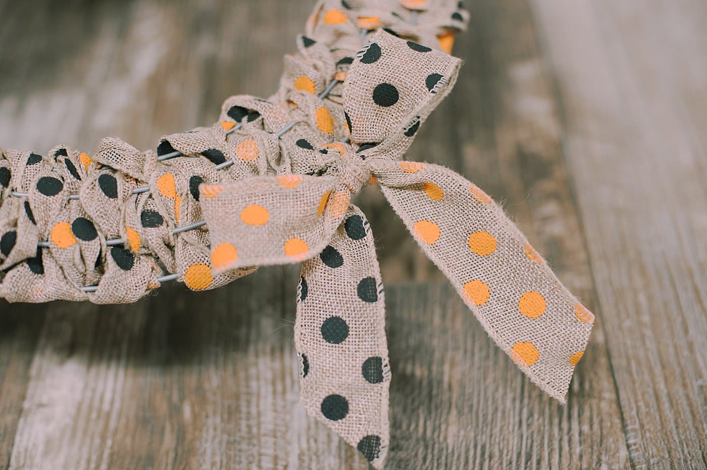 Burlap ribbon bow on burlap ribbon Halloween wreath.