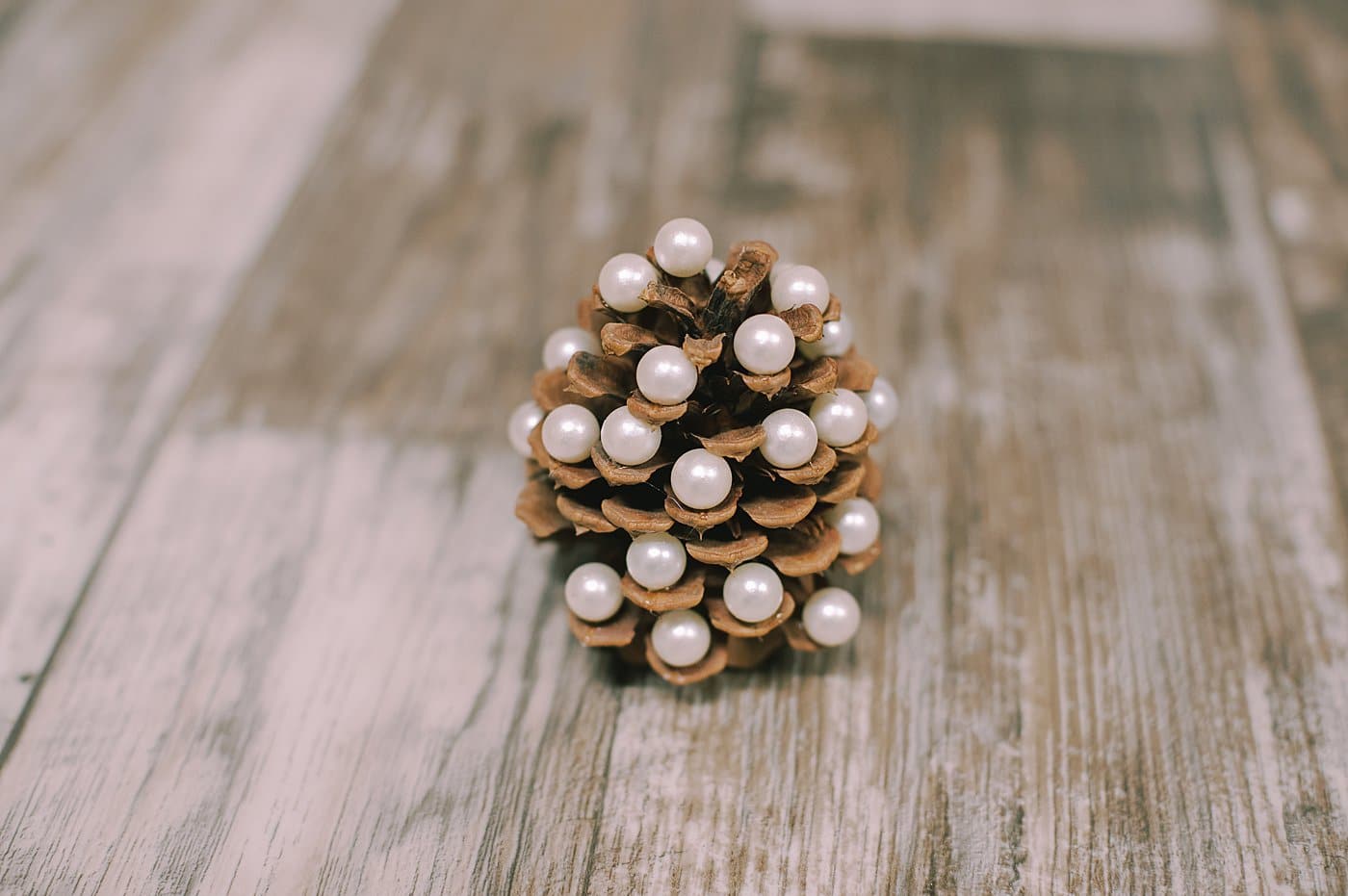 A DIY pearl pine cone Christmas tree.