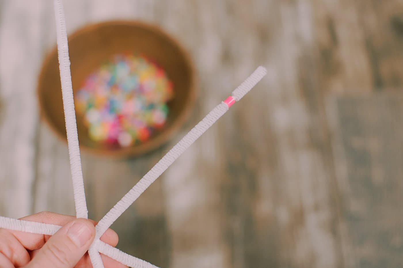 Add perler beads to the pipe cleaners.