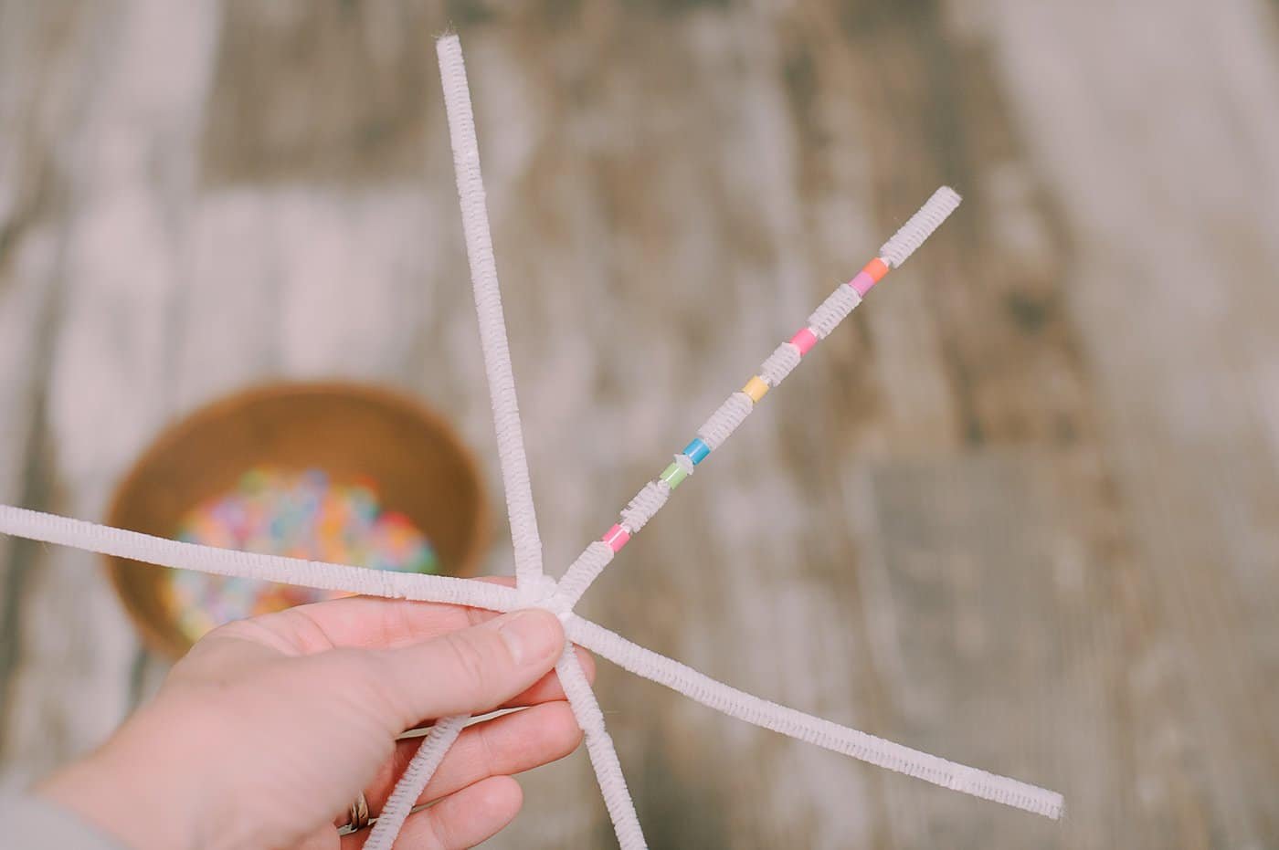 Add perler beads to the pipe cleaners.