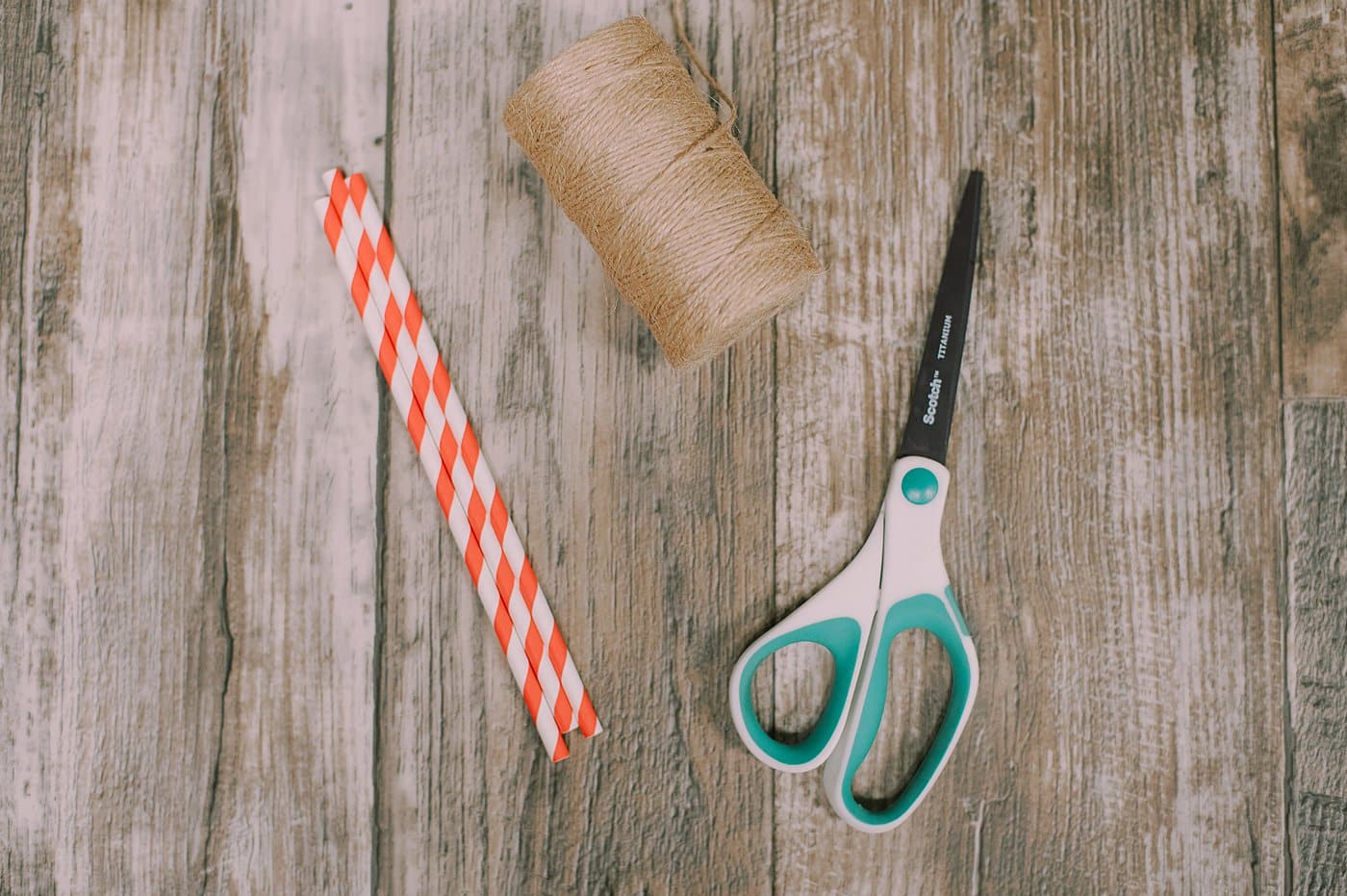 Supplies to make drinking straw star ornaments.