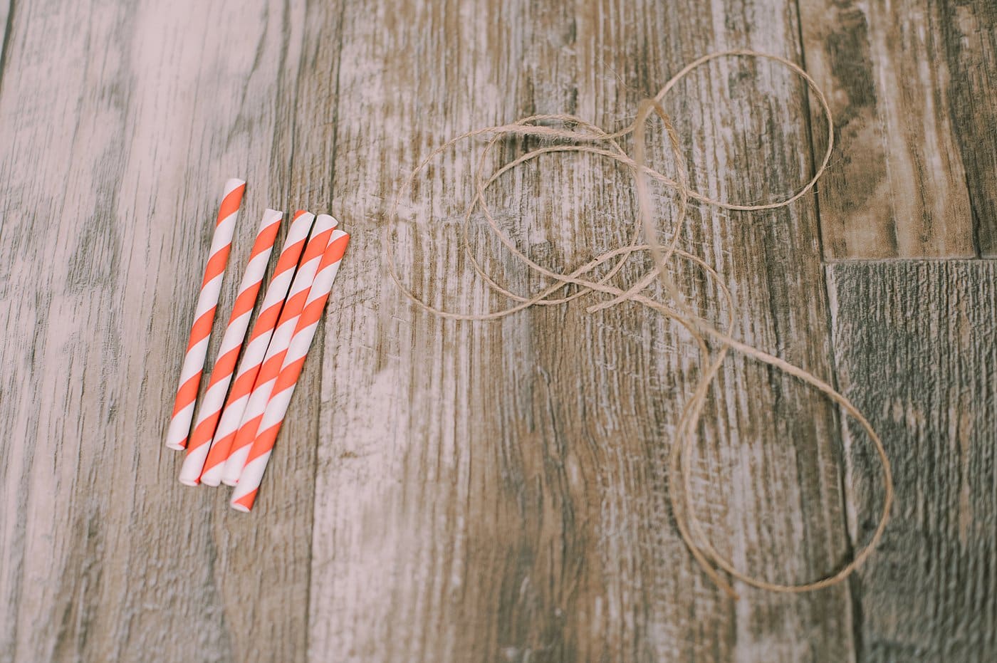 Gather supplies to make straw star ornaments.