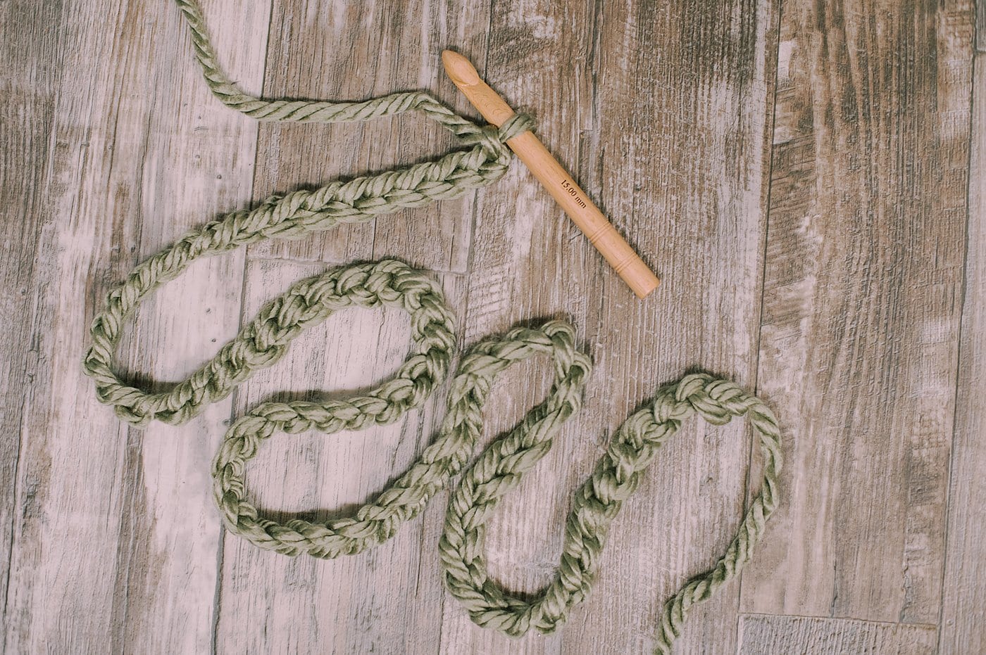 Keep making chain stitches using the chunky yarn and your garland will grow.