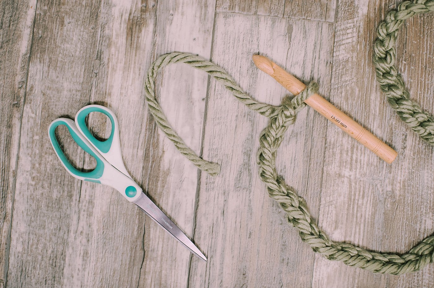 When you're ready to end the chain stitch, cut the yarn at the end, and feed it through the loop on the crochet hook. Pull tight.