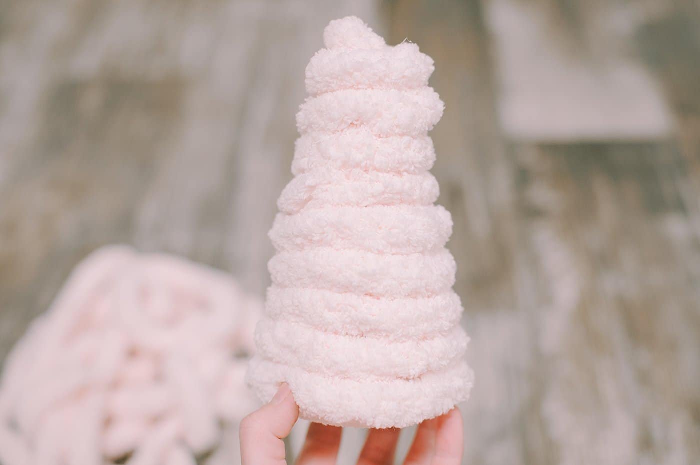 Chunky yarn wrapped styrofoam cone trees for Christmas.