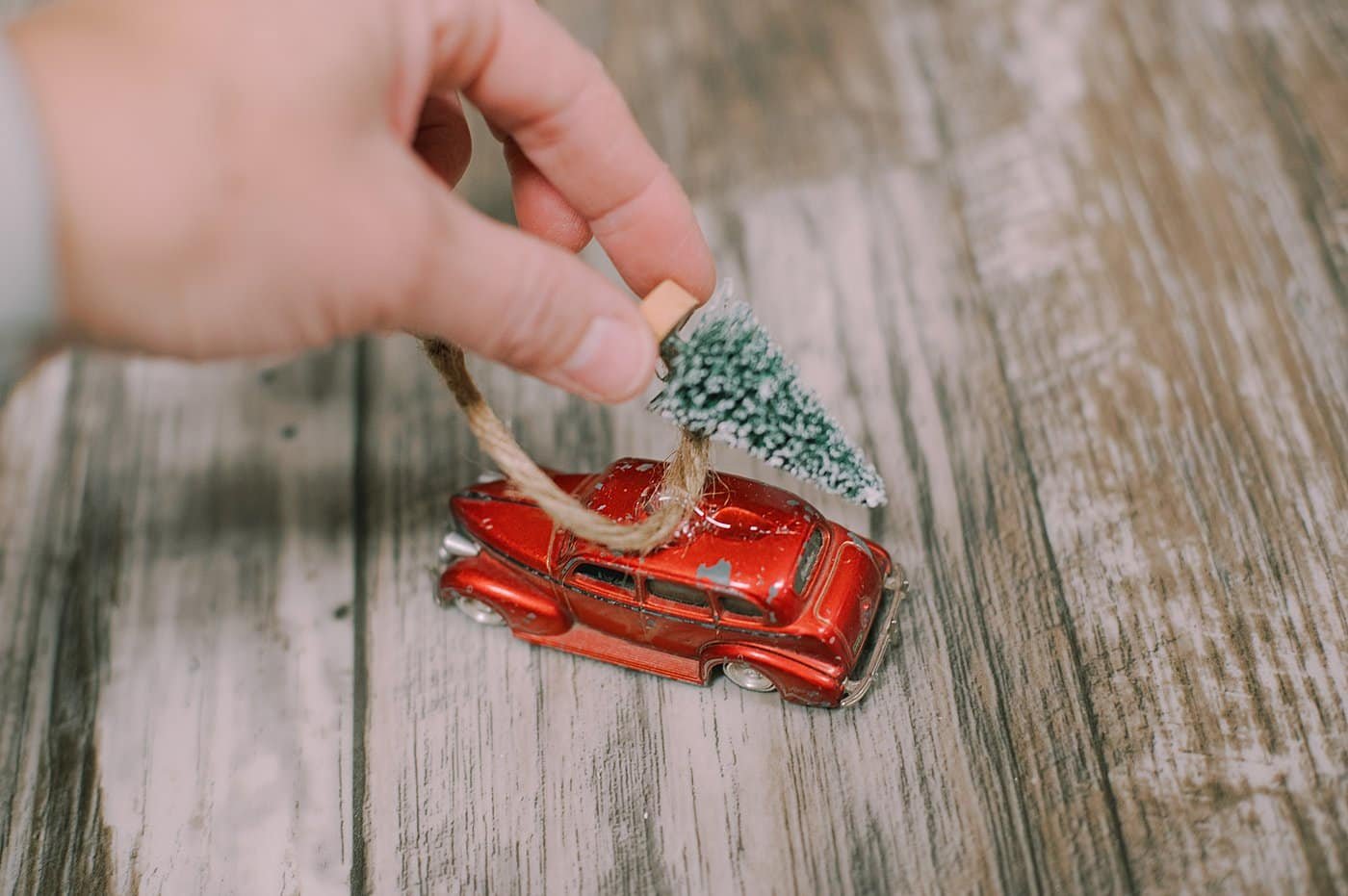 hot glue bottle brush tree to top of the car