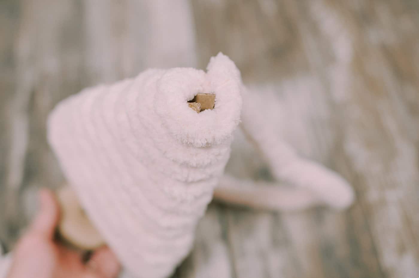 keep wrapping and gluing yarn around the triangle tree shape