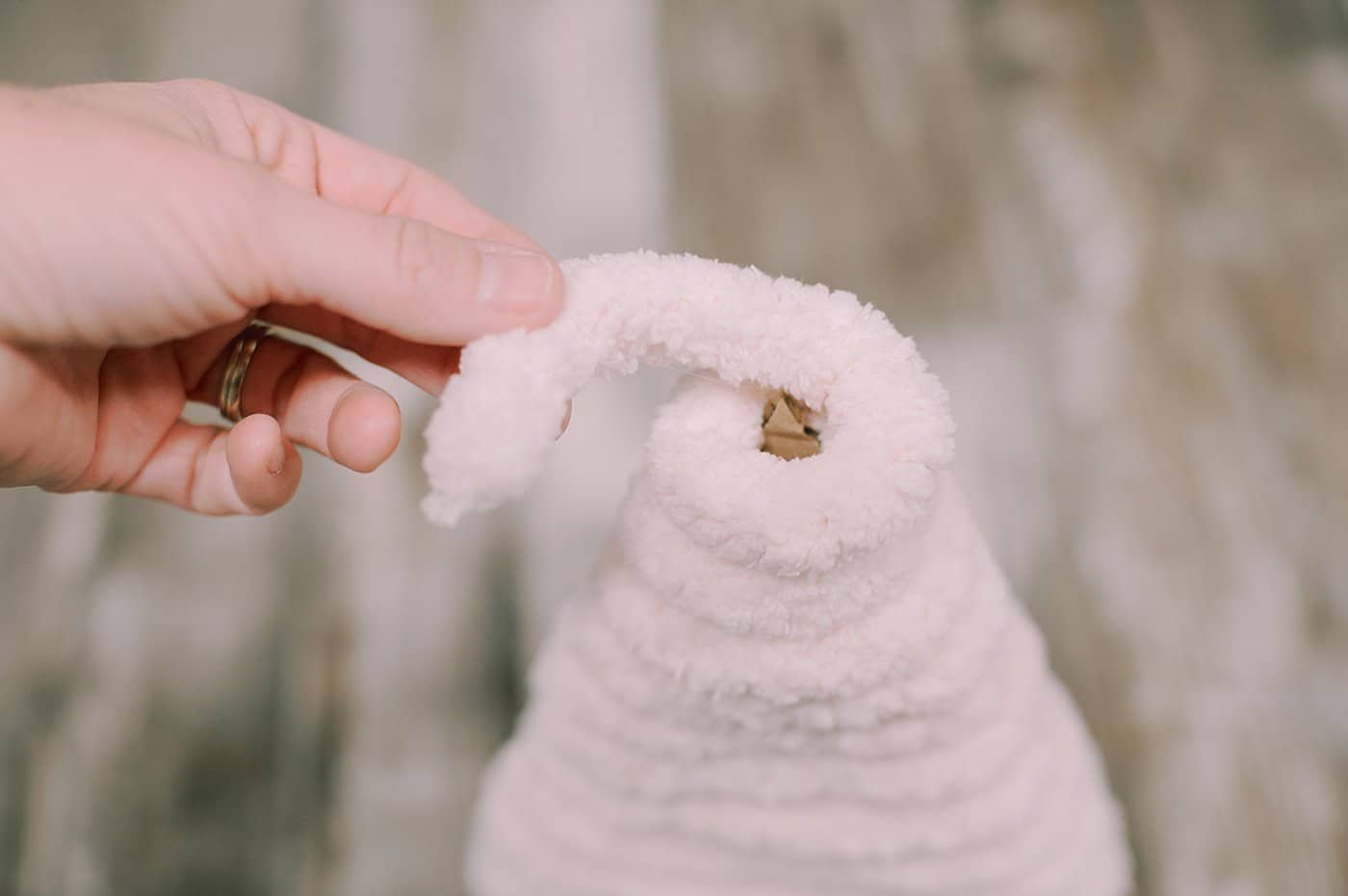 keep wrapping and gluing yarn around the triangle tree shape