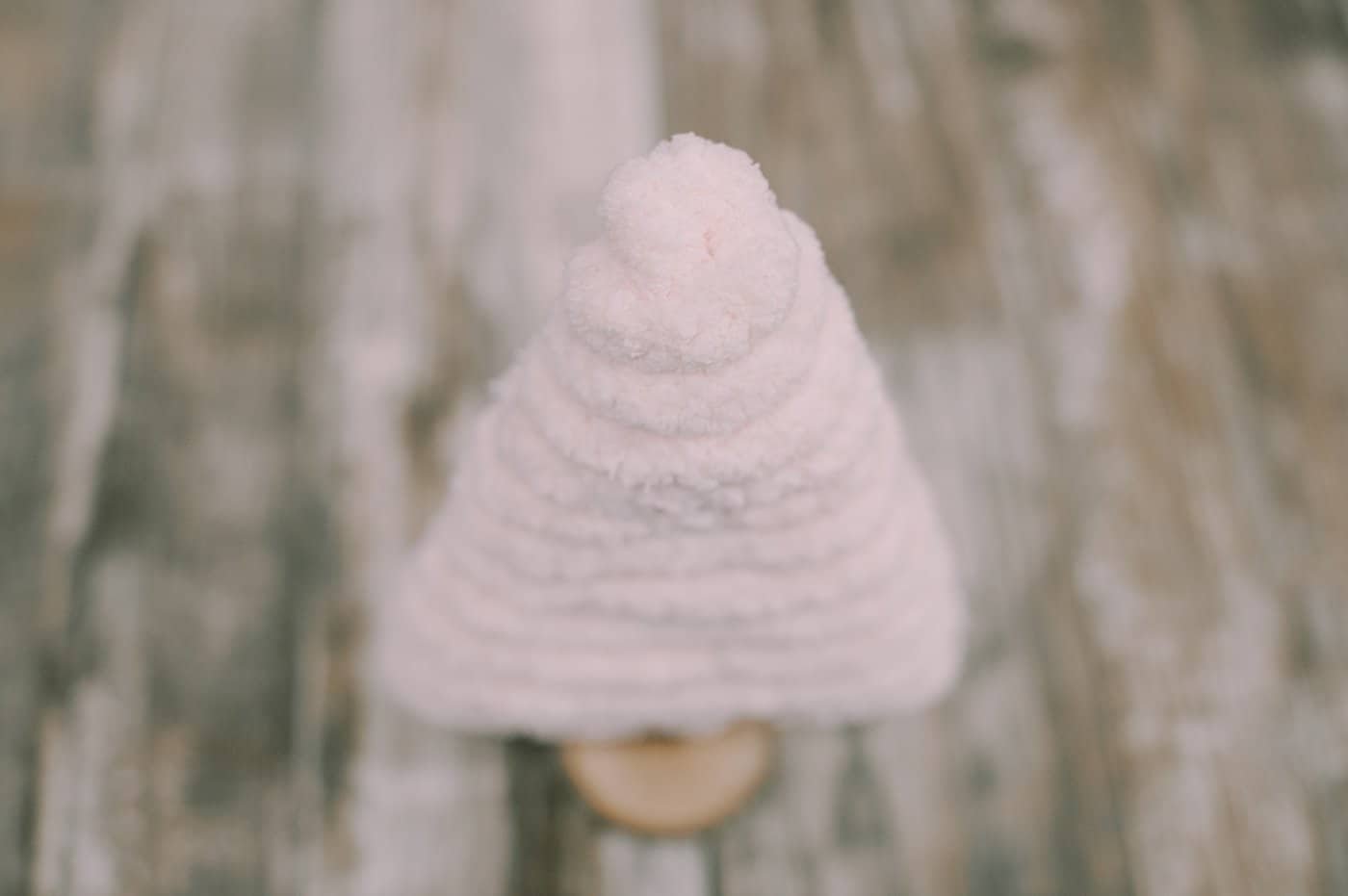 tuck in the tail of the yarn into the tree