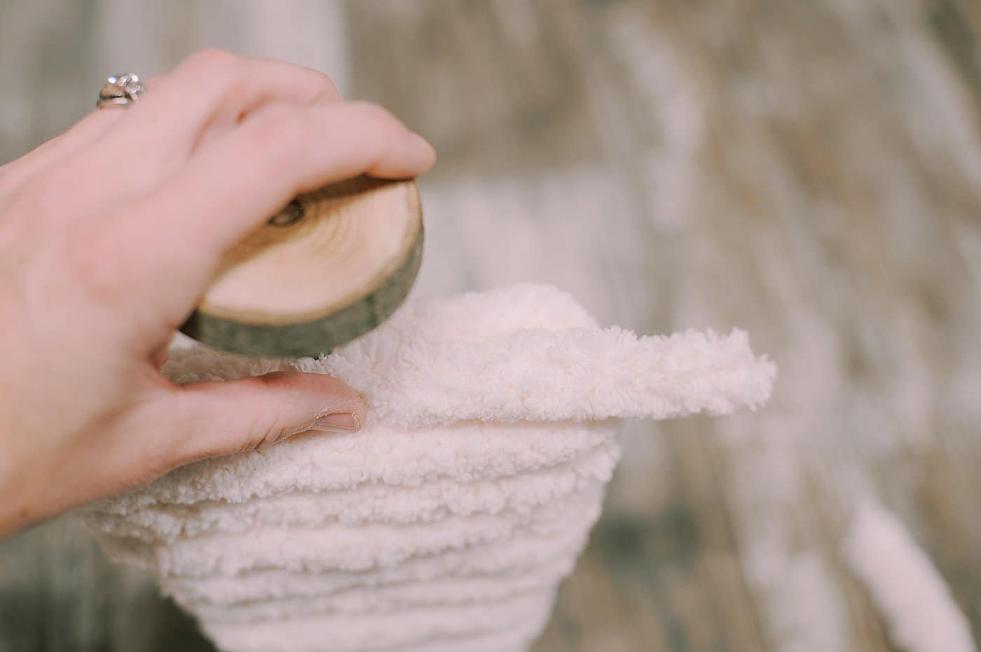 hot glue yarn along the bottom of the cardboard tree to hide the bottom