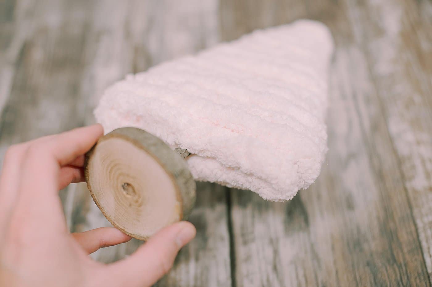 hot glue yarn along the bottom of the cardboard tree to hide the bottom