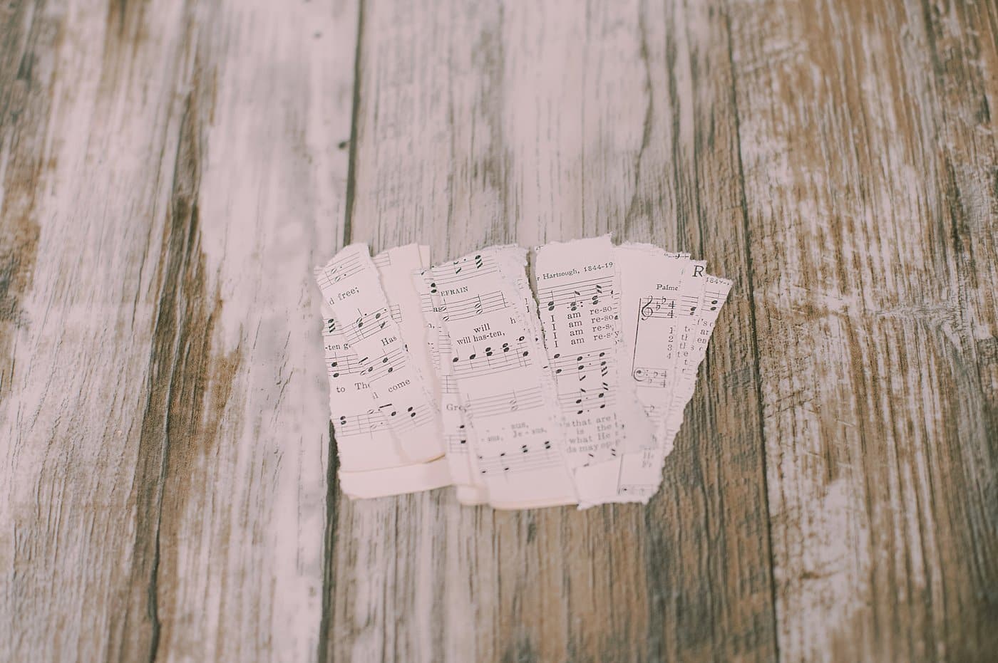 Tear the book pages into strips.