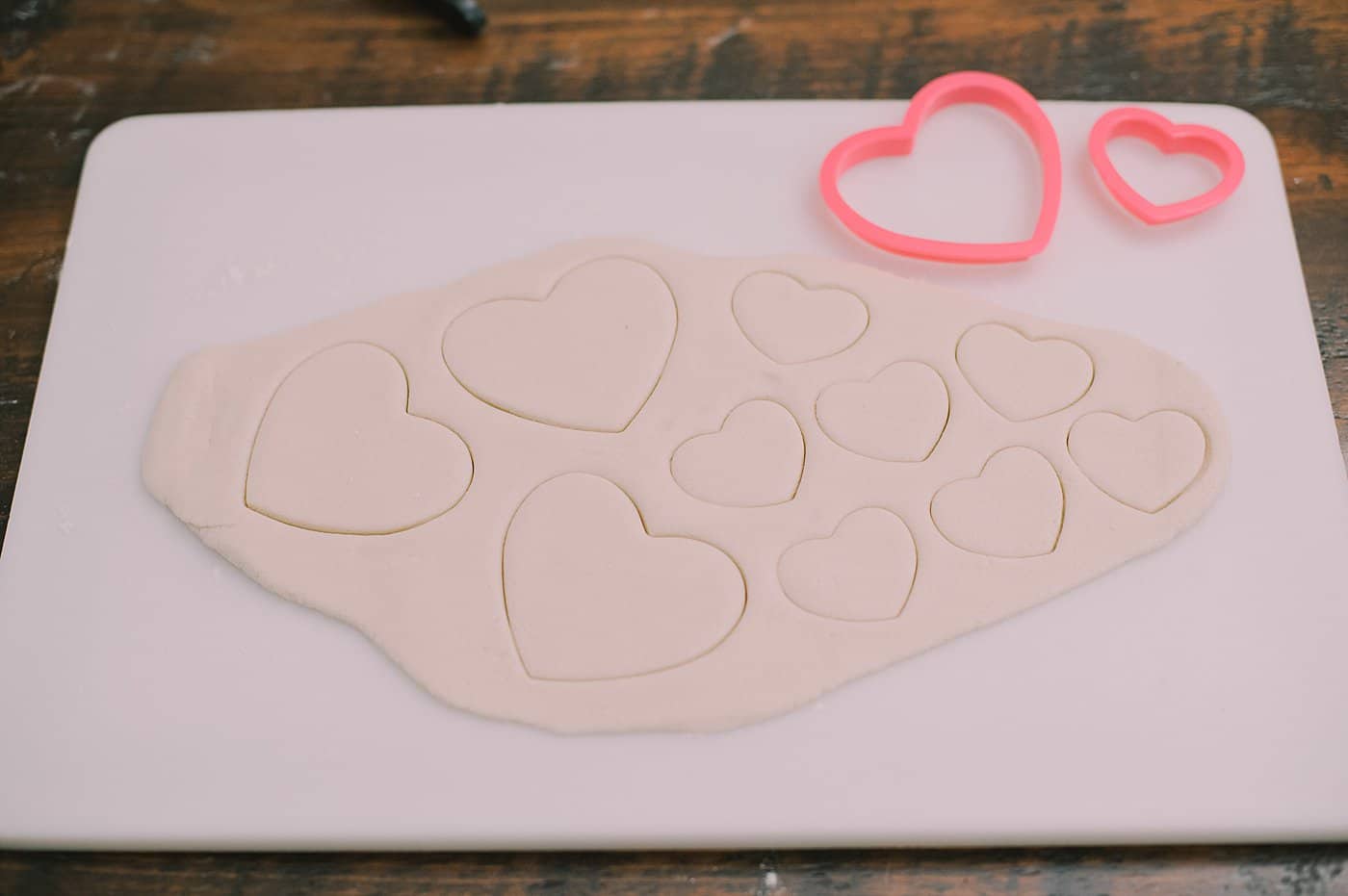 Supplies to make heart shaped salt dough hearts.