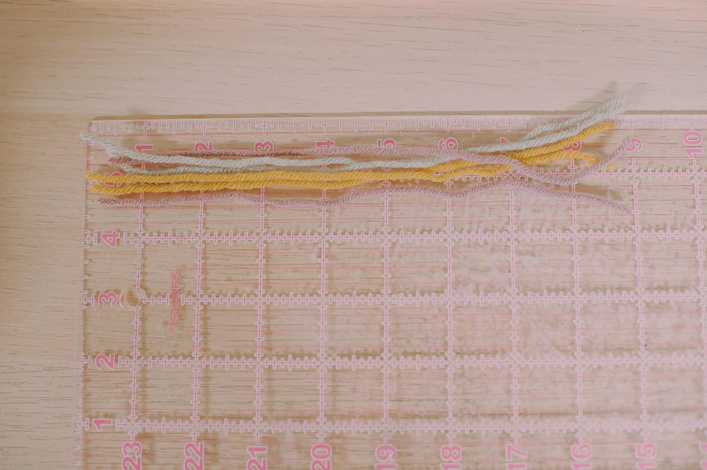 Yarn pieces cut about 8 to 9 inches long.