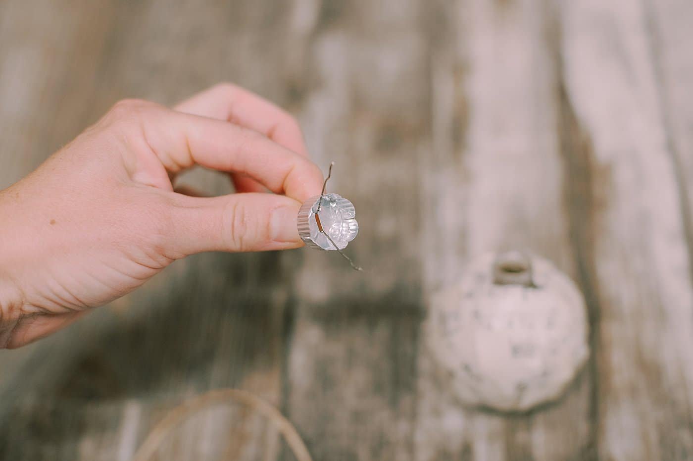 hot glue the top of the ornament to the ball