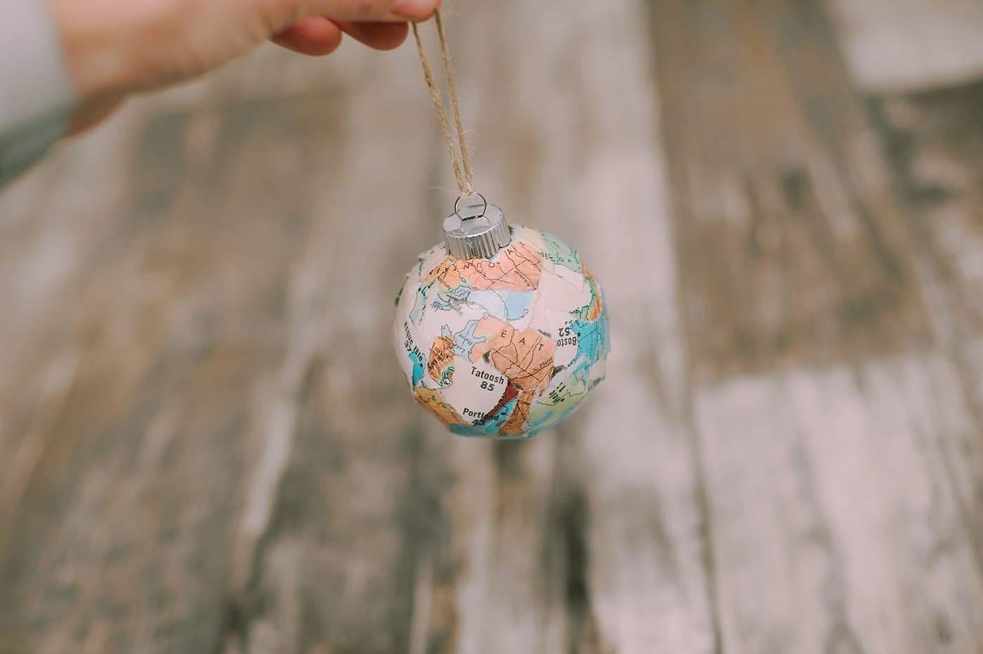 tie twine through the ornament top to hang it