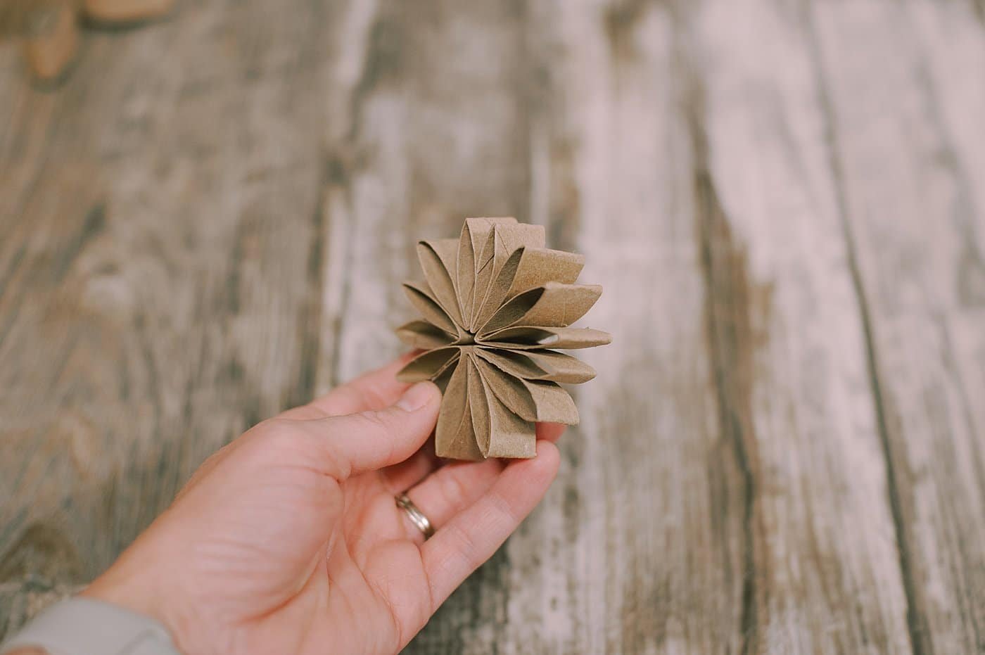 Hot glue more petals together made with toilet paper rolls.