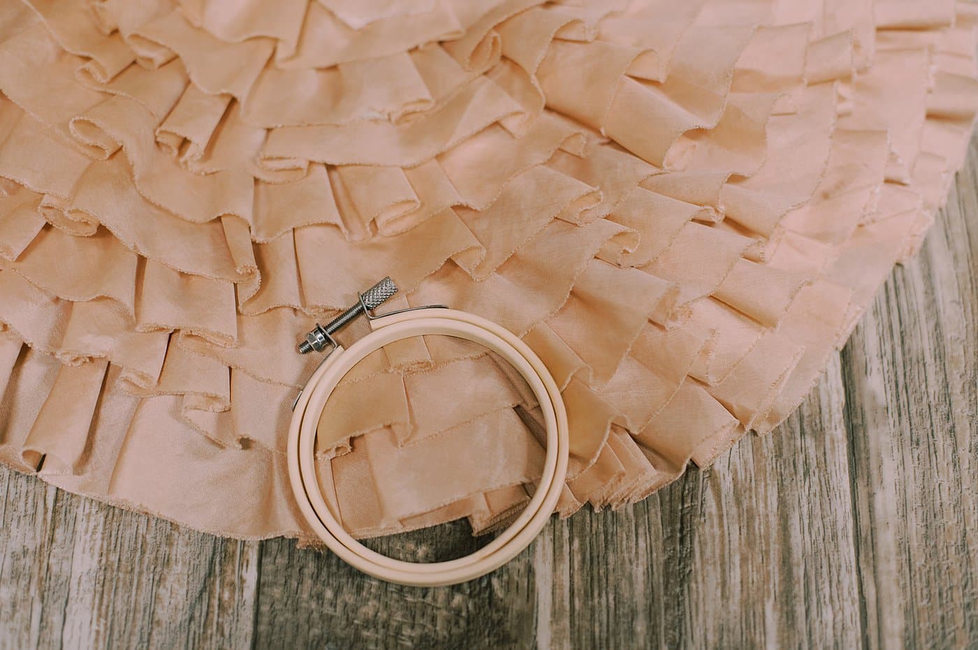 Fabric and a small embroidery hoop.