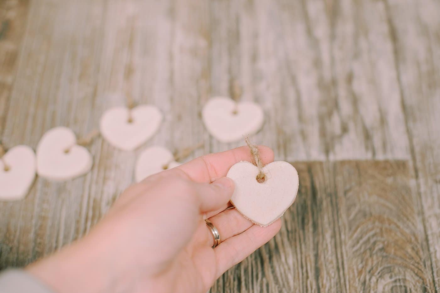 Tie small twine strings to the salt dough ornaments so you can add them to a longer twine string to hang as a garland.