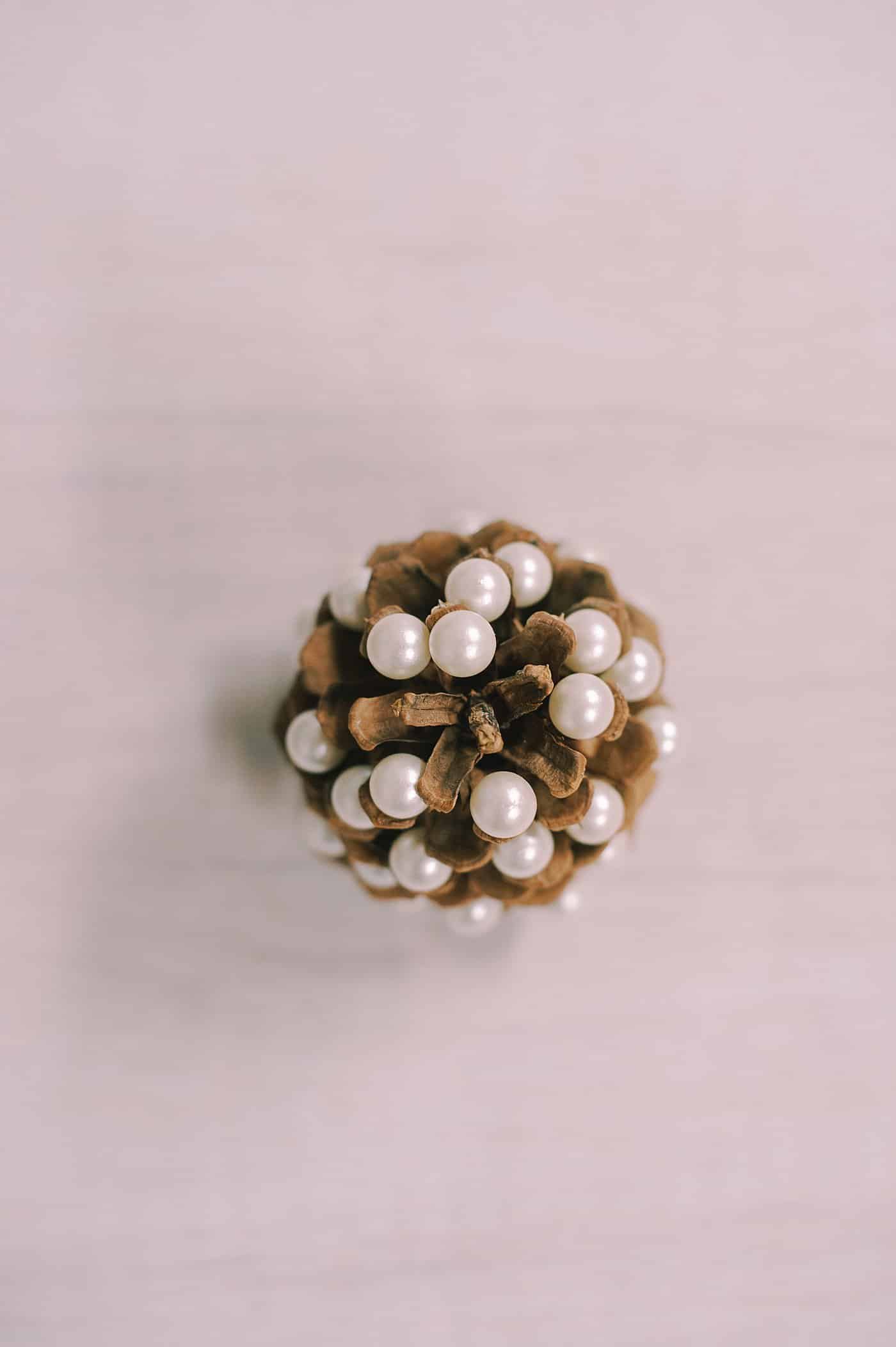 A DIY pearl pine cone Christmas tree.