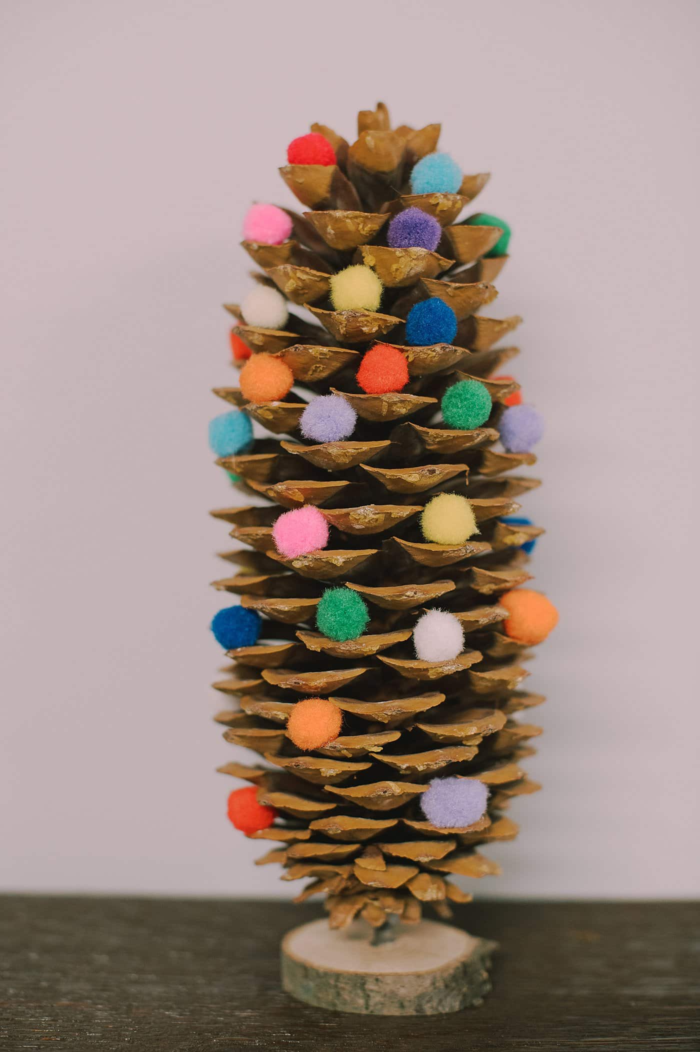 DIY giant pompom pinecone christmas tree.