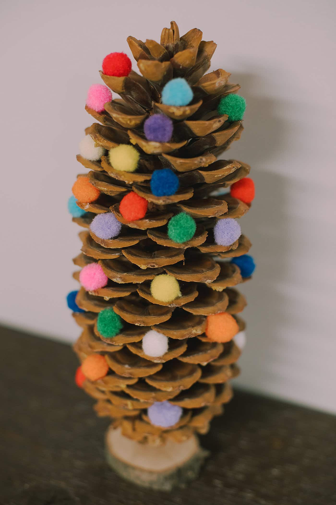 DIY giant pompom pinecone christmas tree.