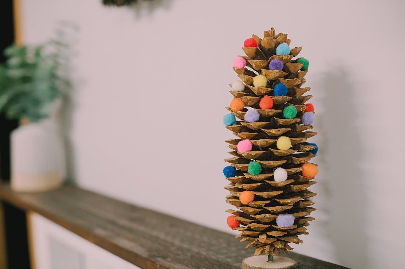 DIY giant pom pom pinecone christmas tree.