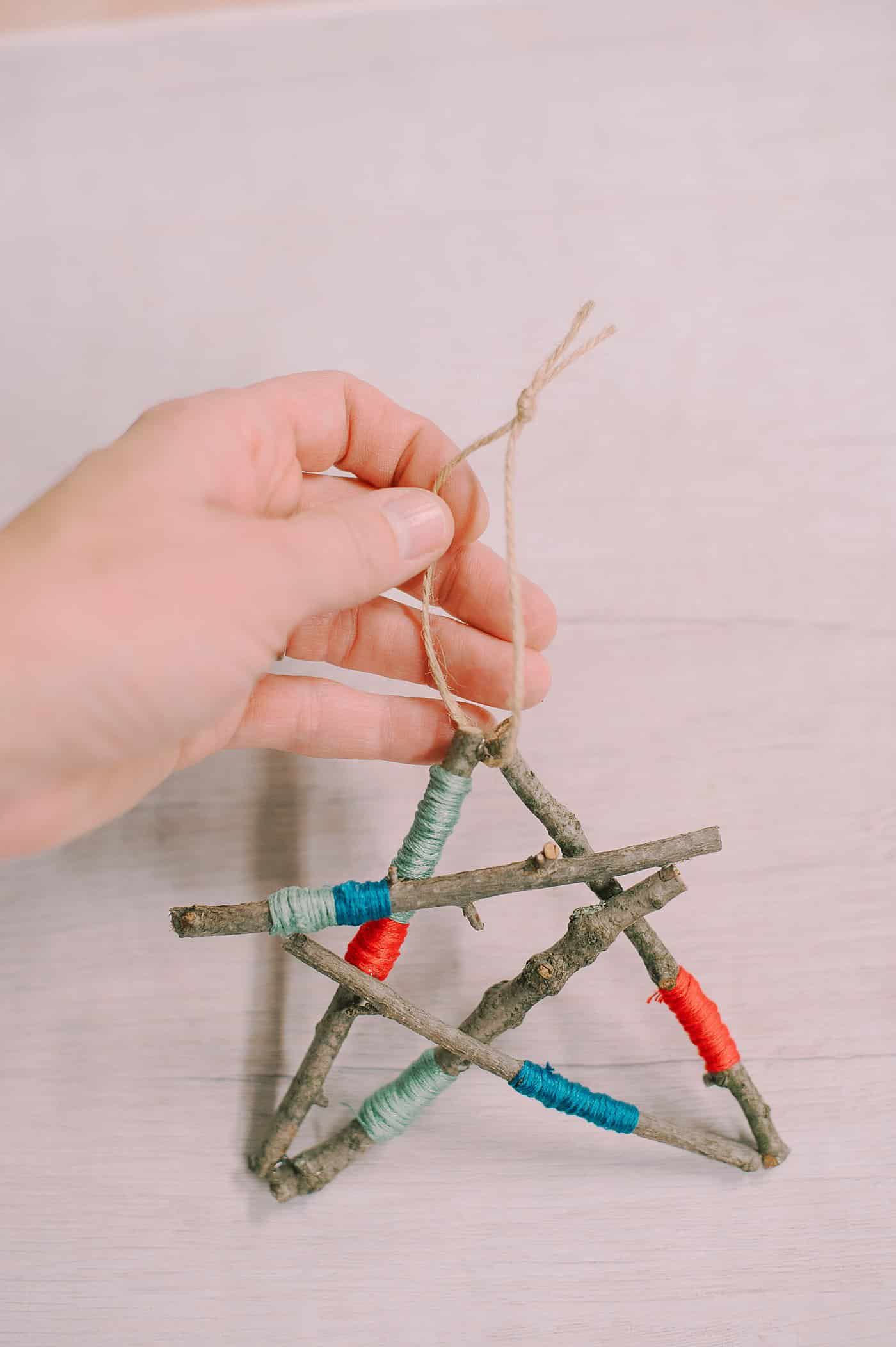 How to Make a Star Ornament out of Emboridery Floss Wrapped Sticks.