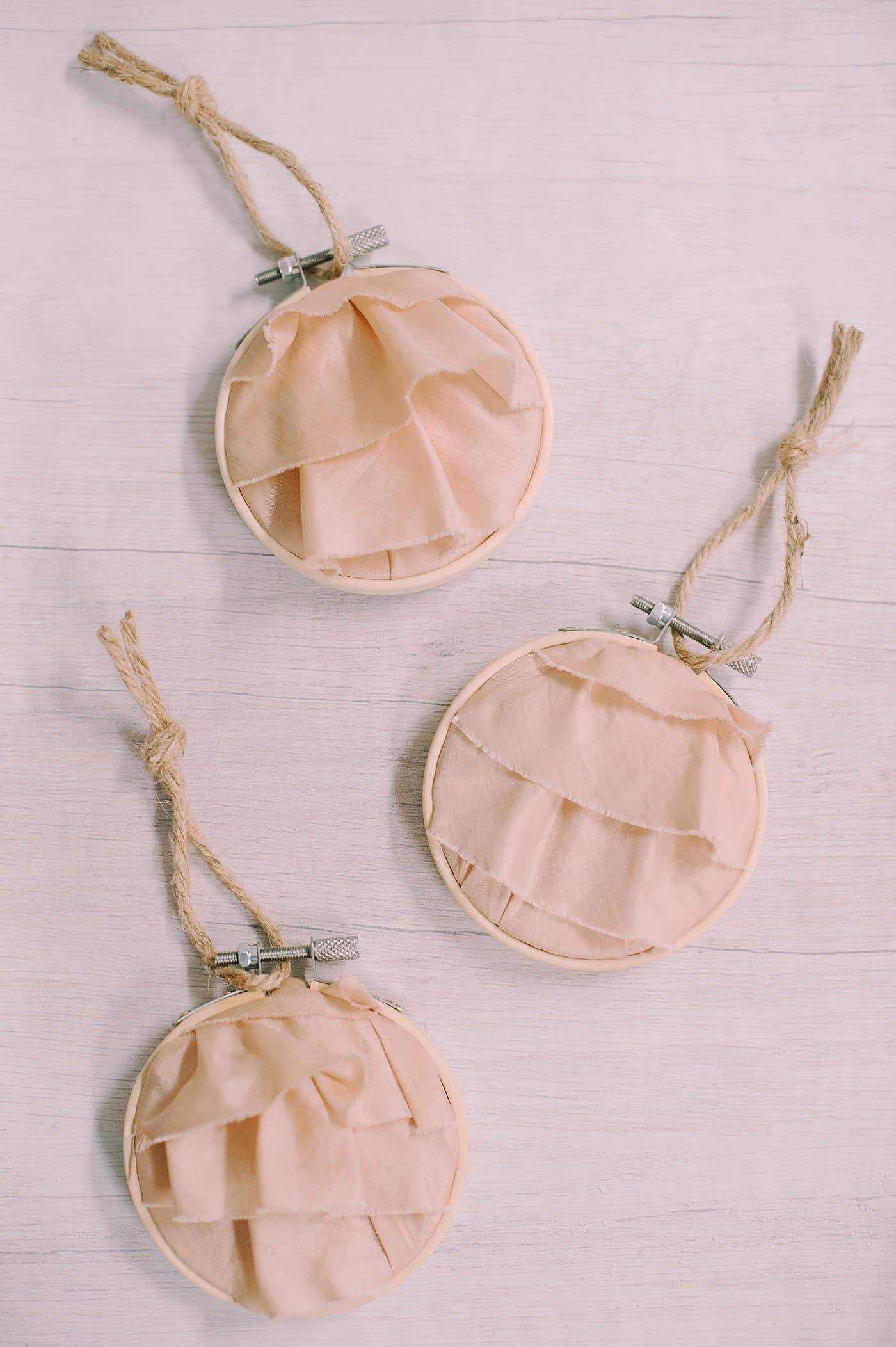 Three embroidery hoop memory ornaments.