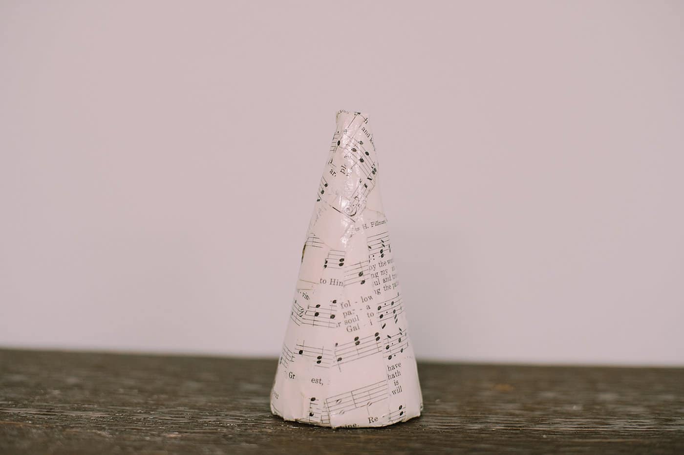 A DIY Mod Podge Book Page Cone Tree.