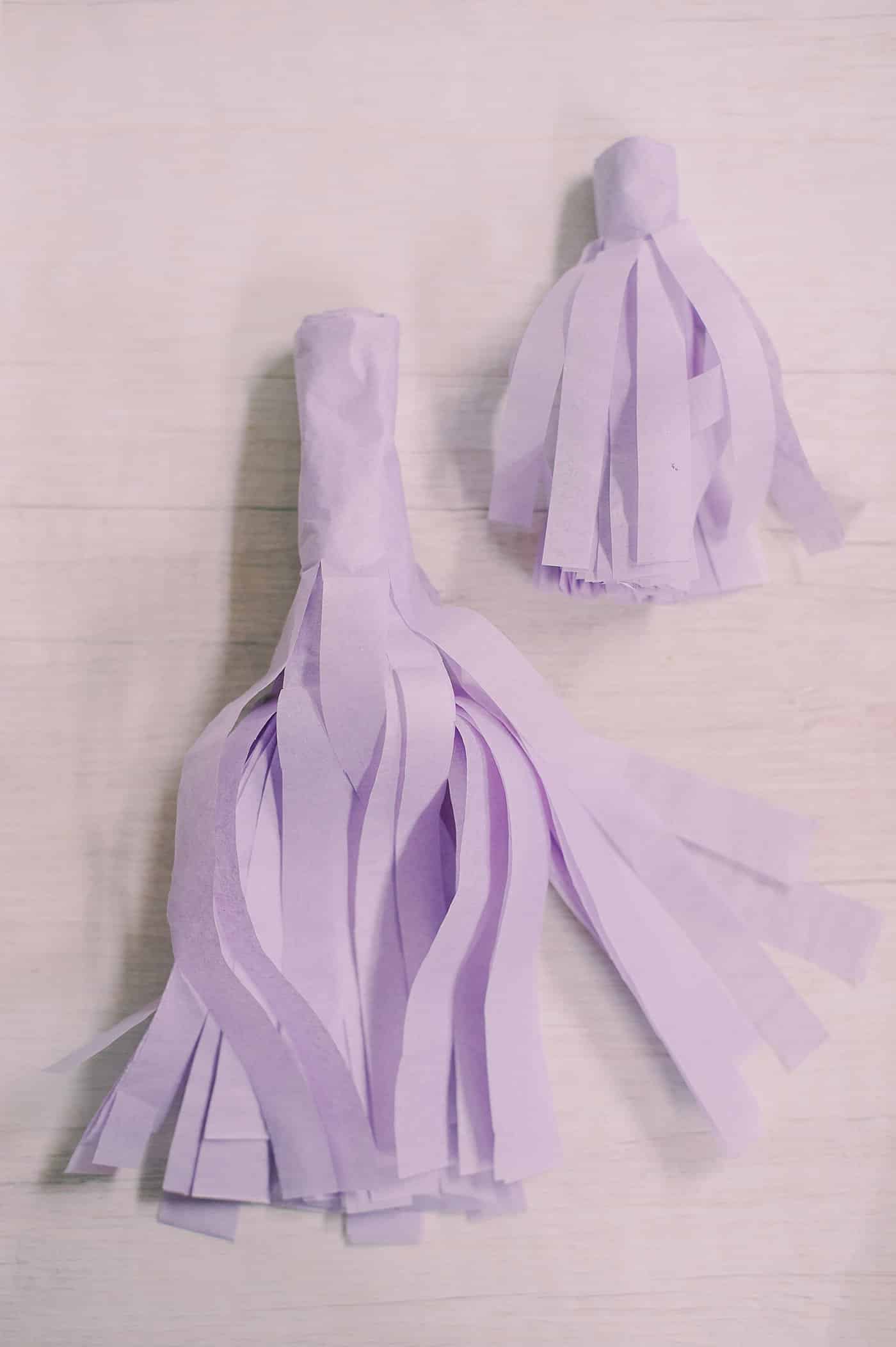 Two tissue paper tassels.