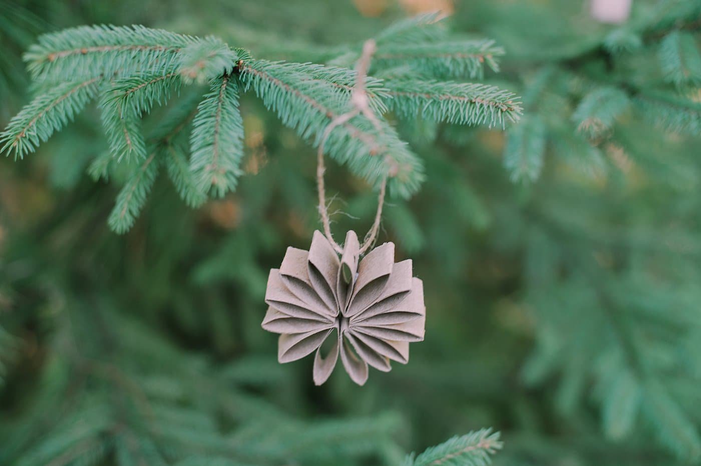 A DIY toilet paper roll flower ornament.